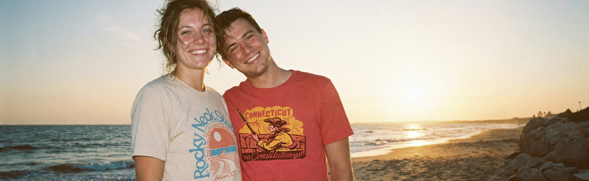 two friends wearing Connecticut apparel from HomeTown Riot.